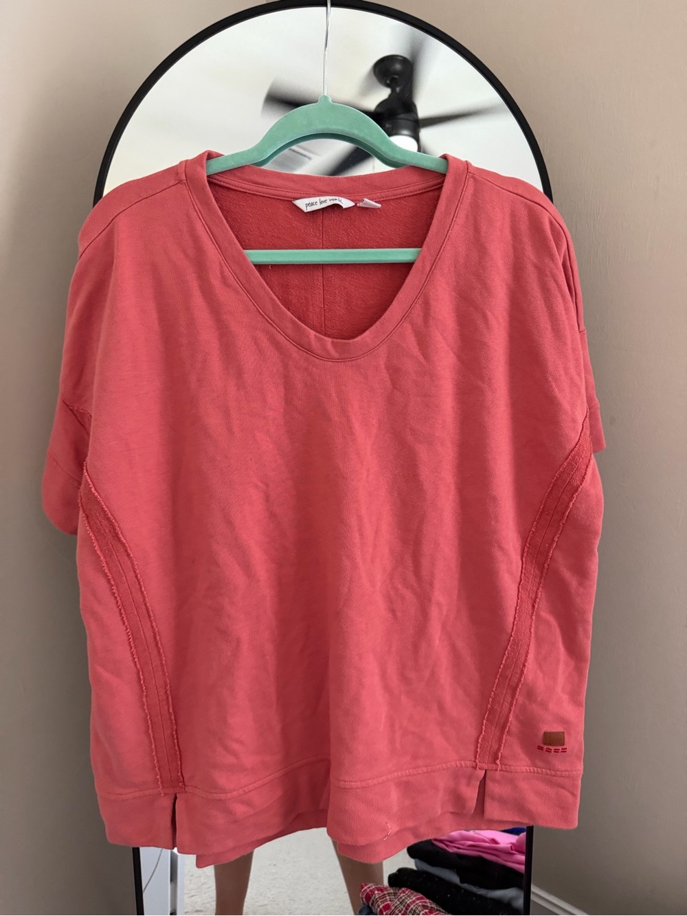 Peace Love World Boxy Coral V-Neck Top